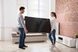 couple moving tv